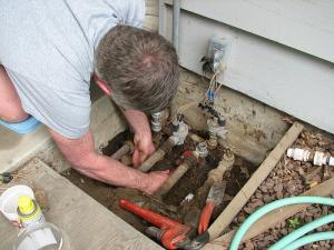 Ben is inspecting the backflow prevention unit